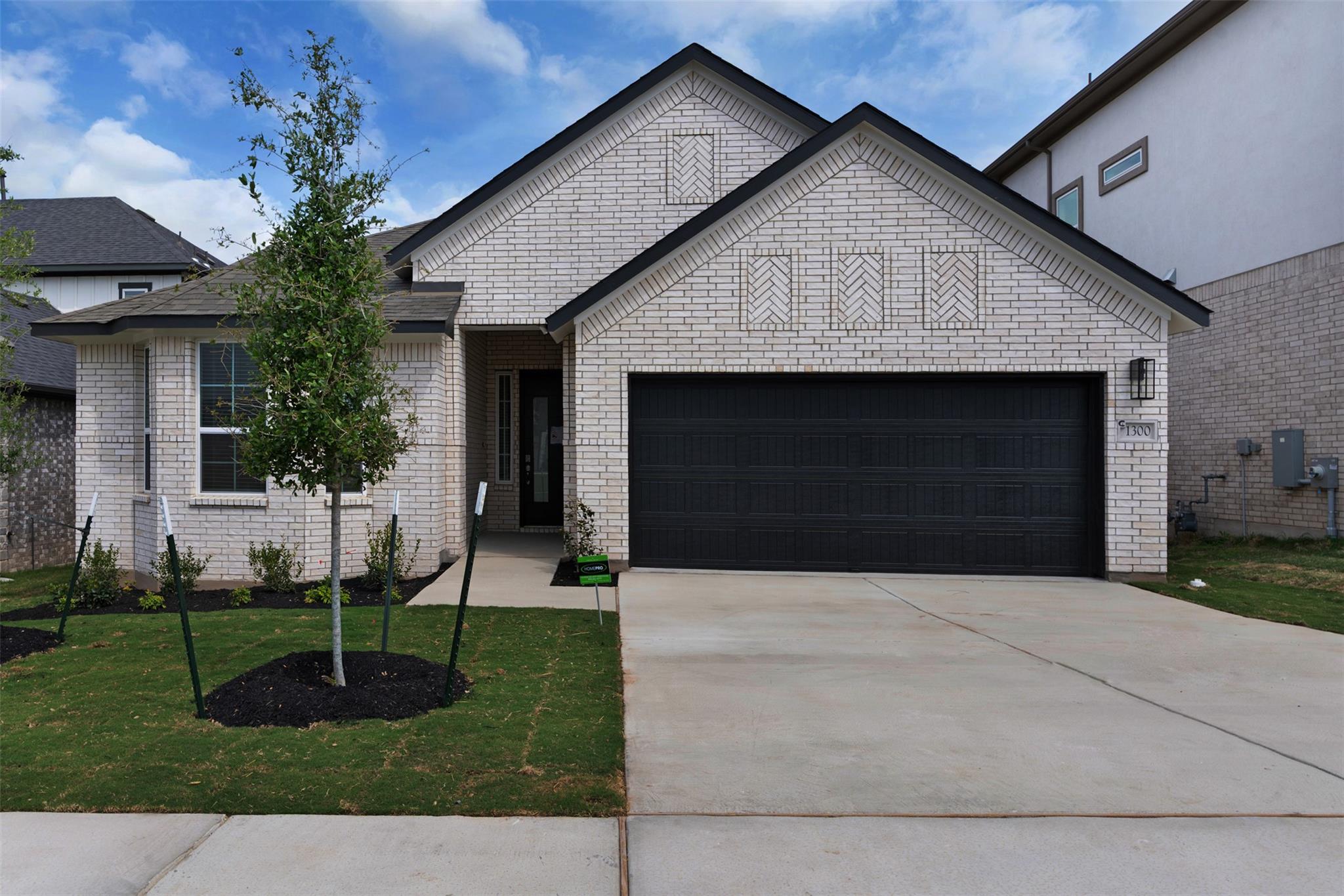 A newly built residence with a two-car garage fea