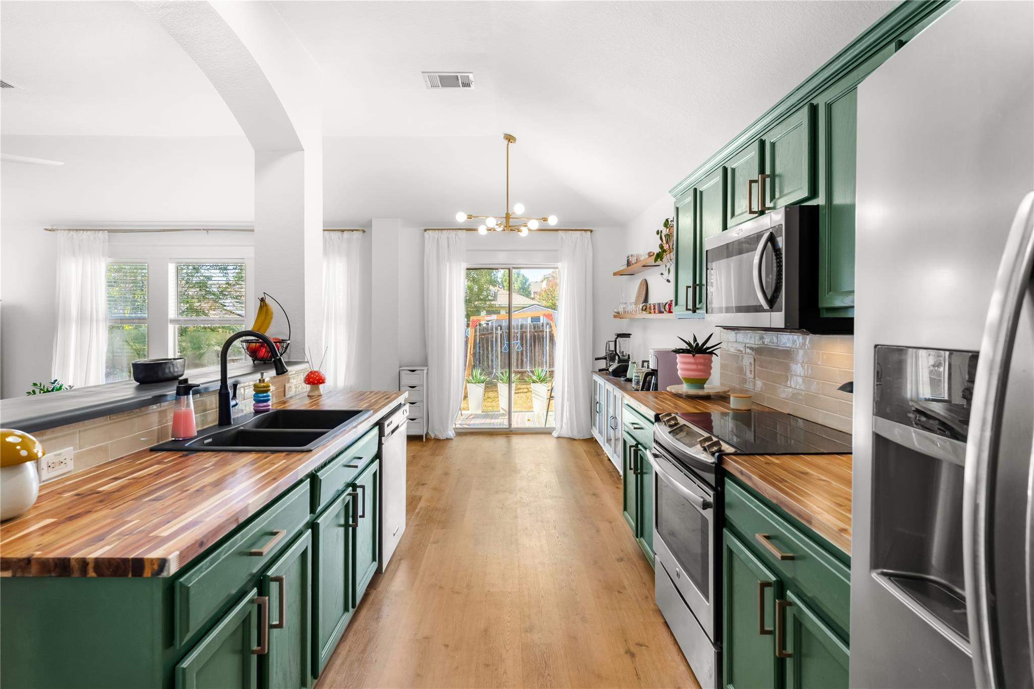 Natural wood countertops and custom cabinetry fra