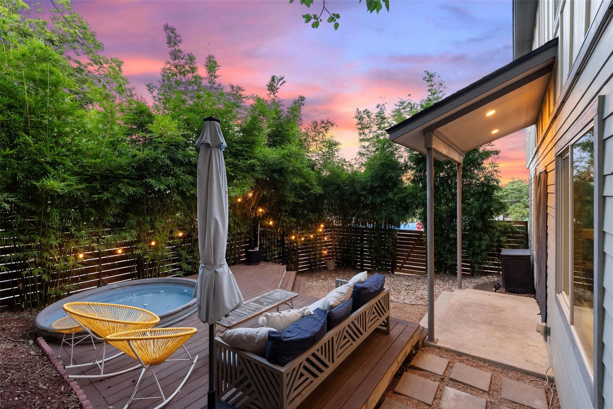 An inviting backyard oasis offers a spacious wood