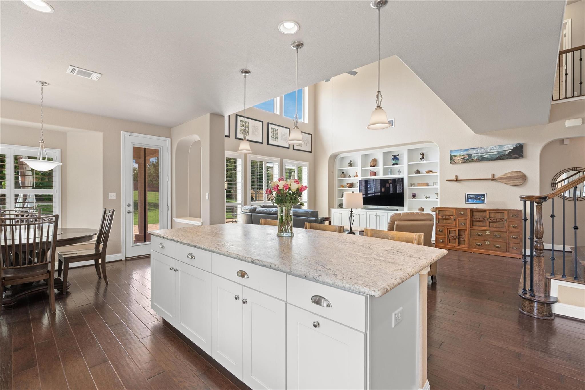 An open-concept living space features an expansiv