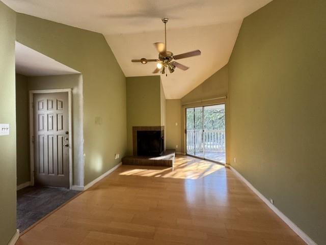 High vaulted ceilings and rich wood-style floorin