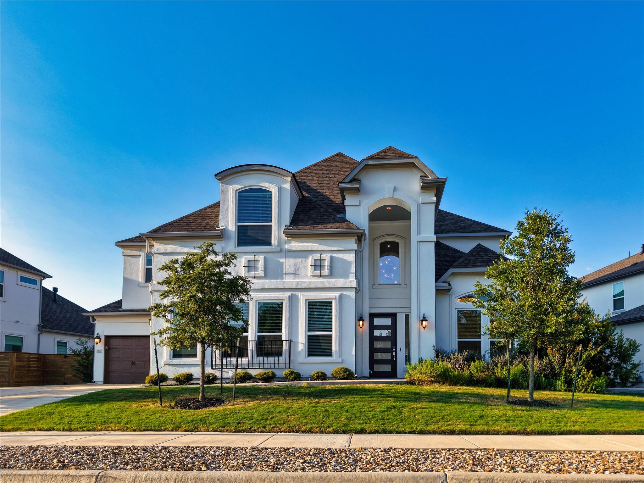 Grand architectural details define this pristine 