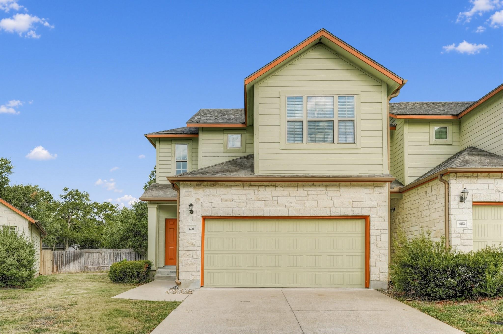 A harmonious blend of stone and siding adorns thi