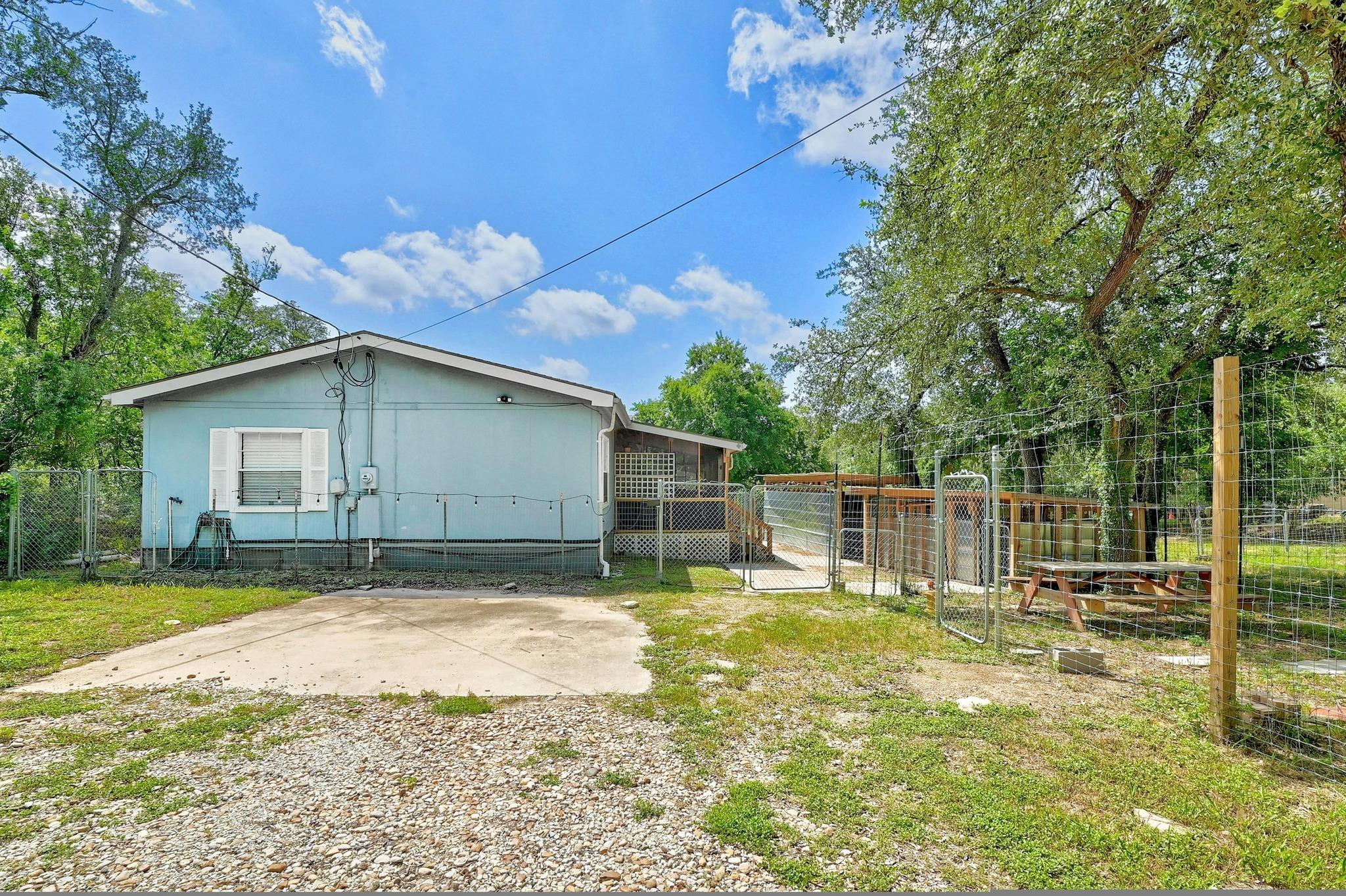 A quaint backyard with practical chain link fenci