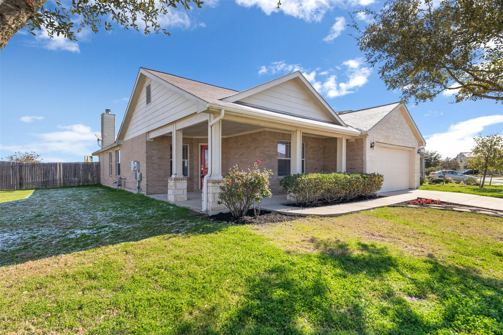 A welcoming front porch, garage, and well-maintai