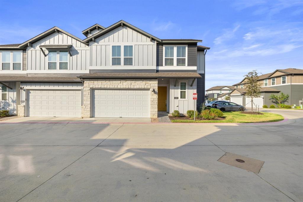 Modern townhomes showcasing board and batten sidi