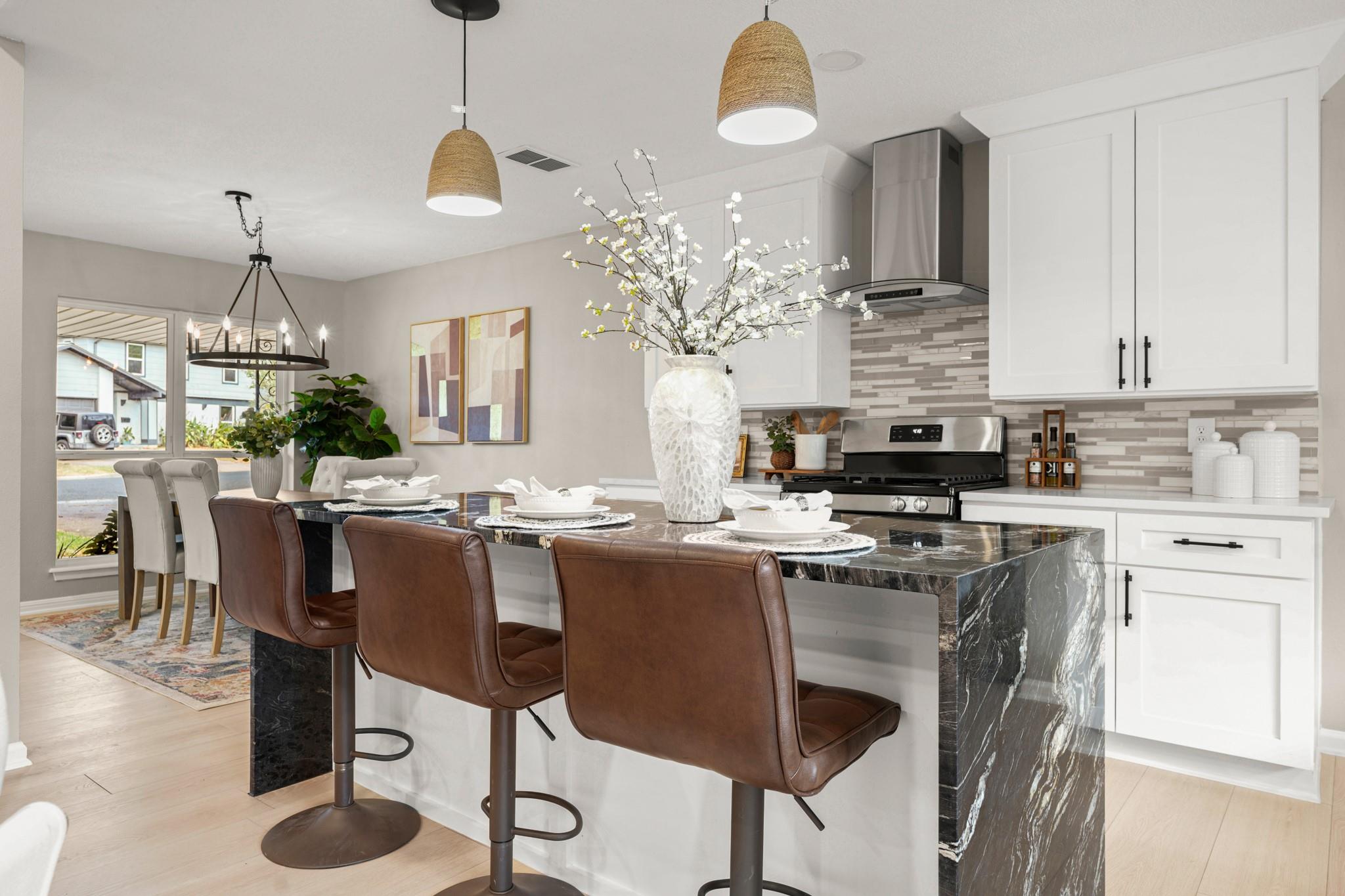Granite counters highlight a spacious kitchen isl