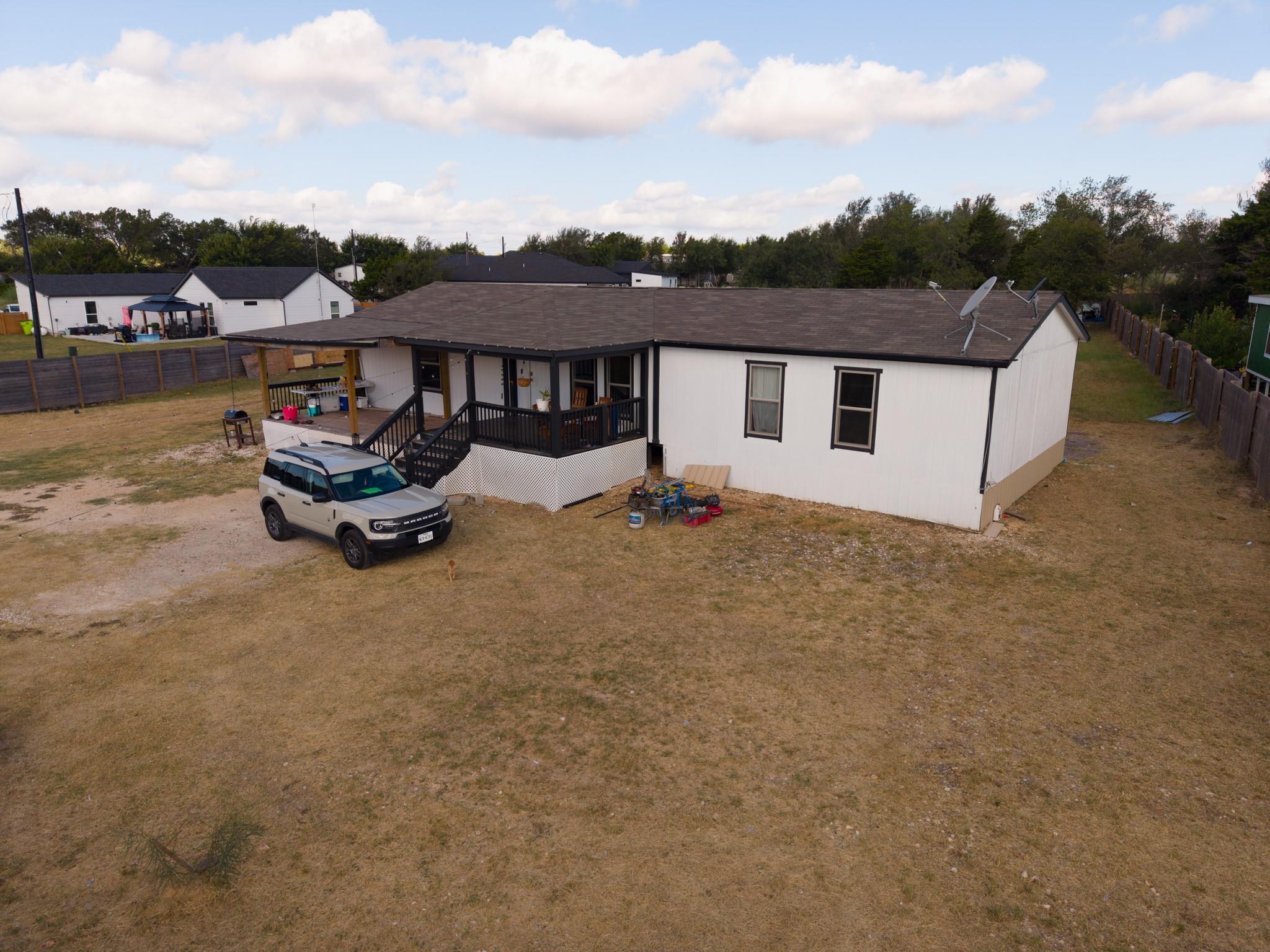 An aerial perspective showcases a single-story ho