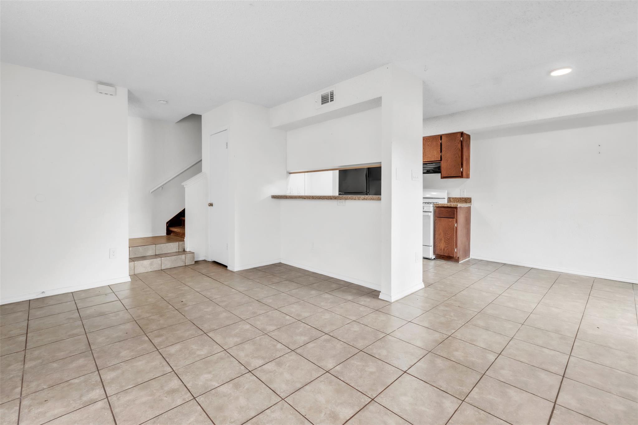 Tiled floors and an open flow connect the main li
