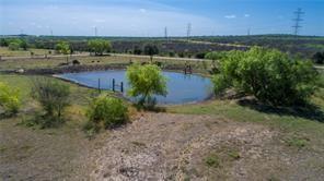 A tranquil pond graces this expansive rural lot, 