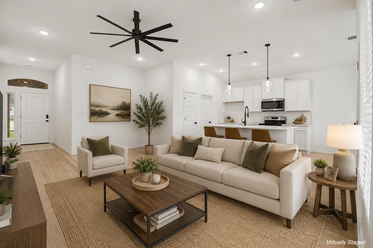 An open floorplan seamlessly connects the bright 