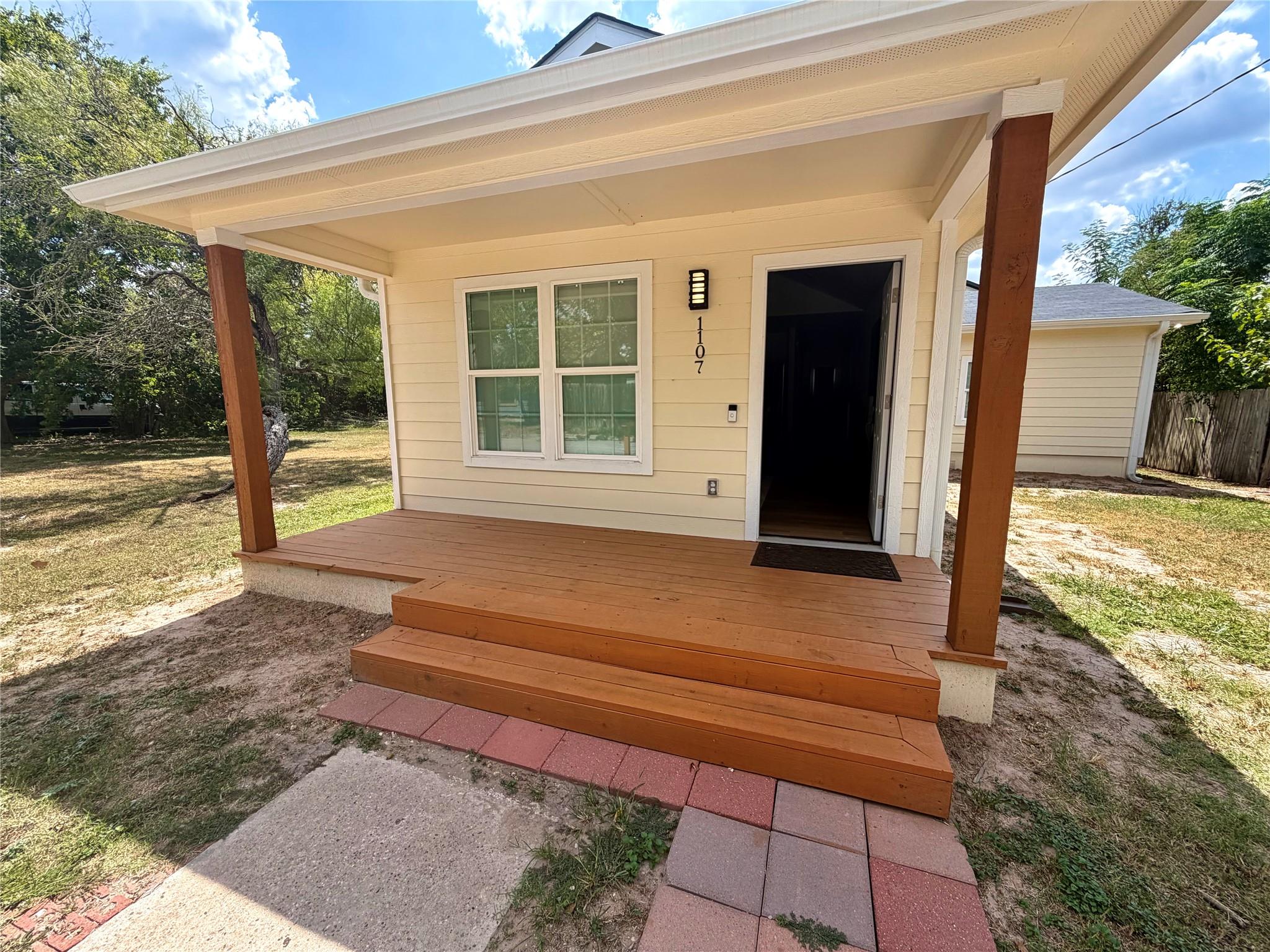 A welcoming front deck offers an inviting entranc