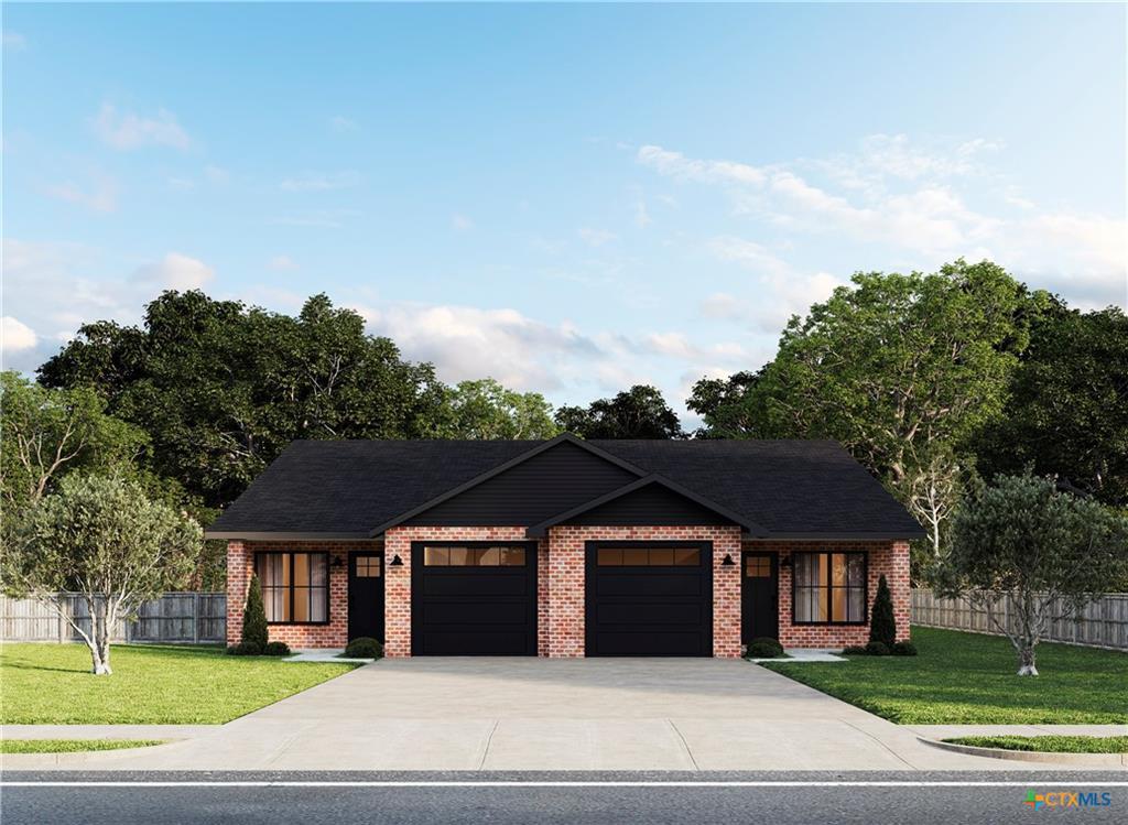A classic brick facade with dual garage doors pre