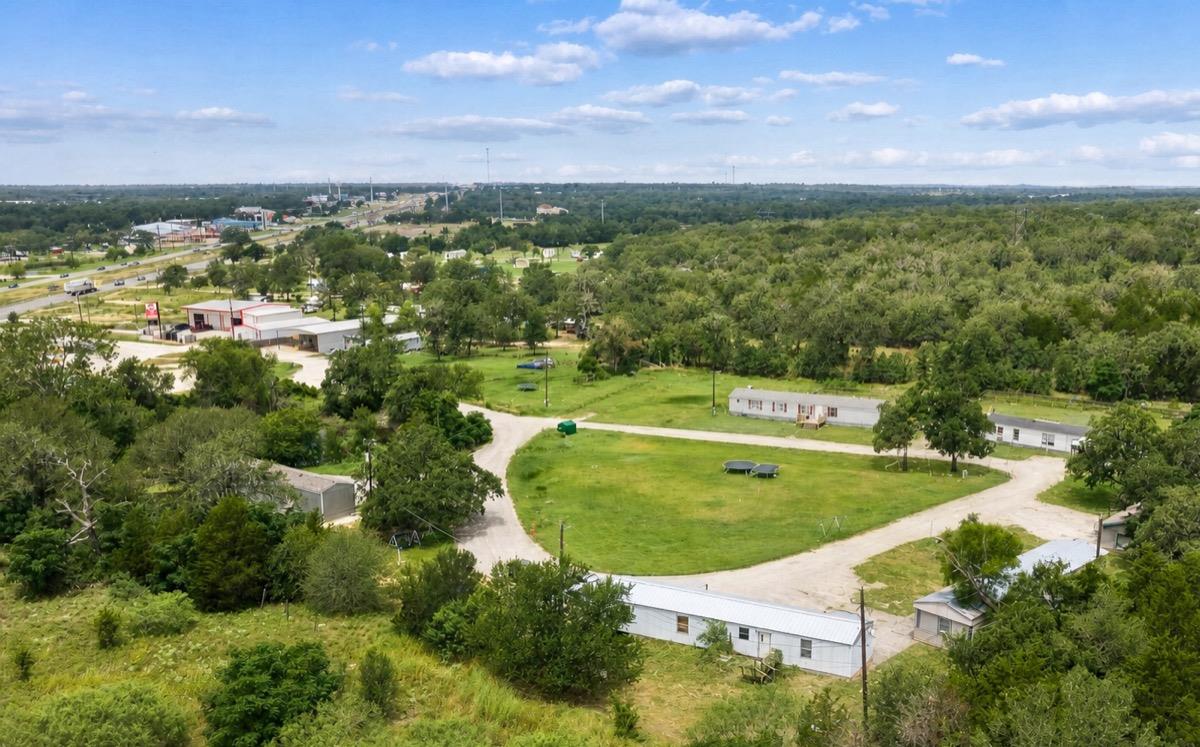 A sprawling rural landscape with several structur