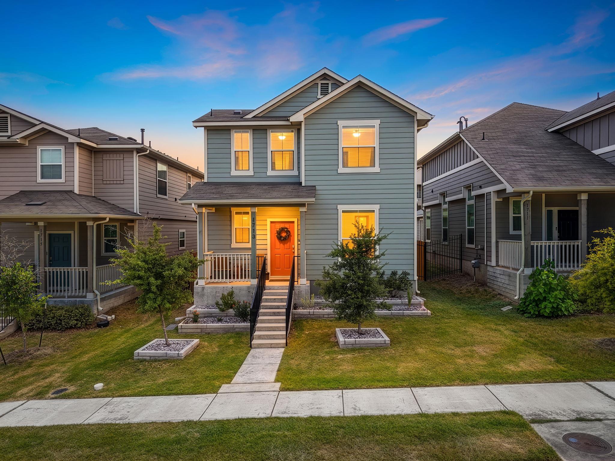 A welcoming front porch and manicured landscaping