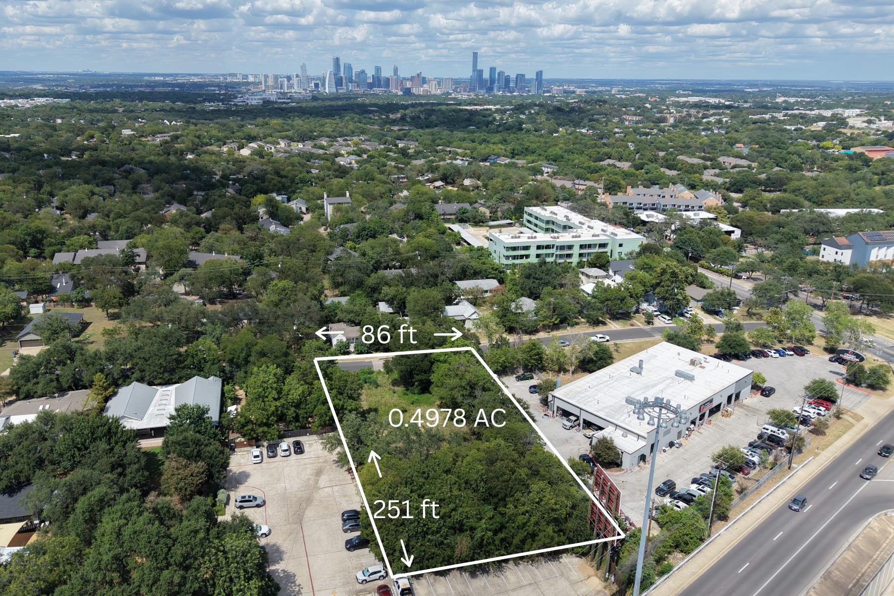 A spacious half-acre lot offers prime development
