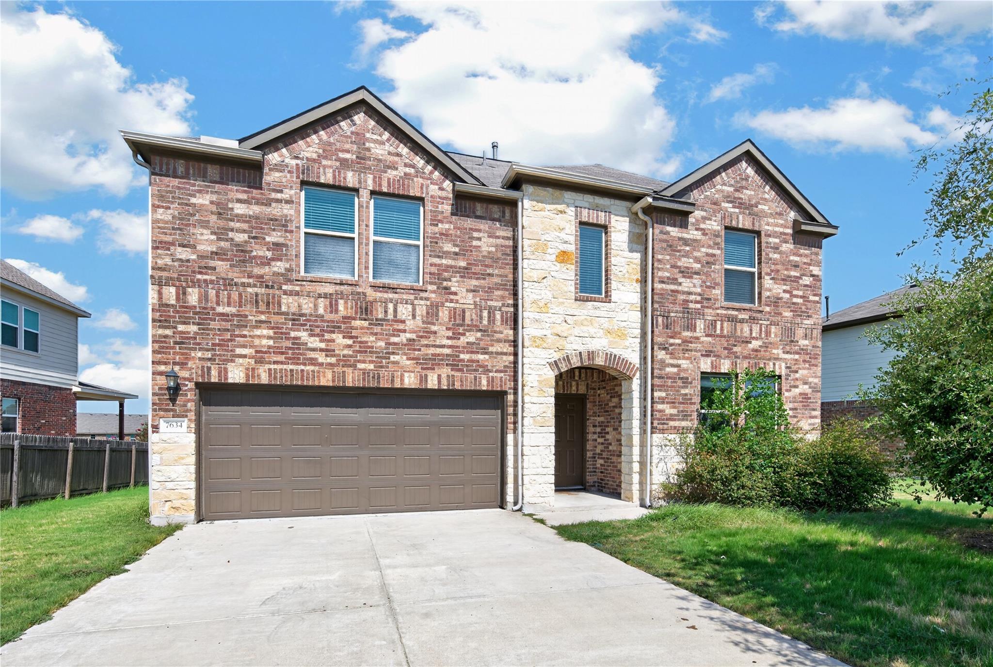 A well-maintained two-story residence with a blen