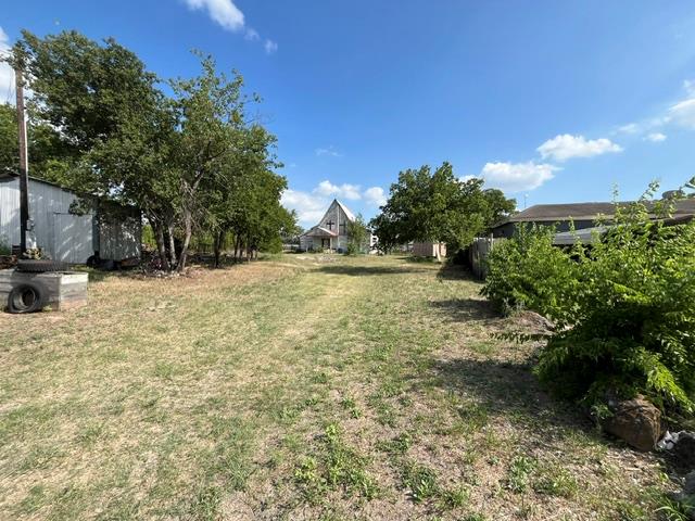 A spacious, open yard offers ample room for outdo