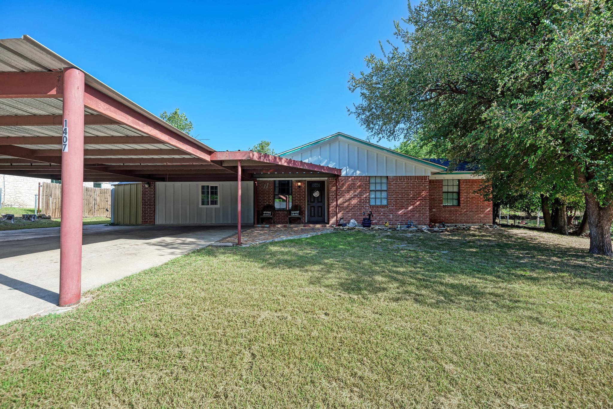 A well-maintained brick exterior home offers conv