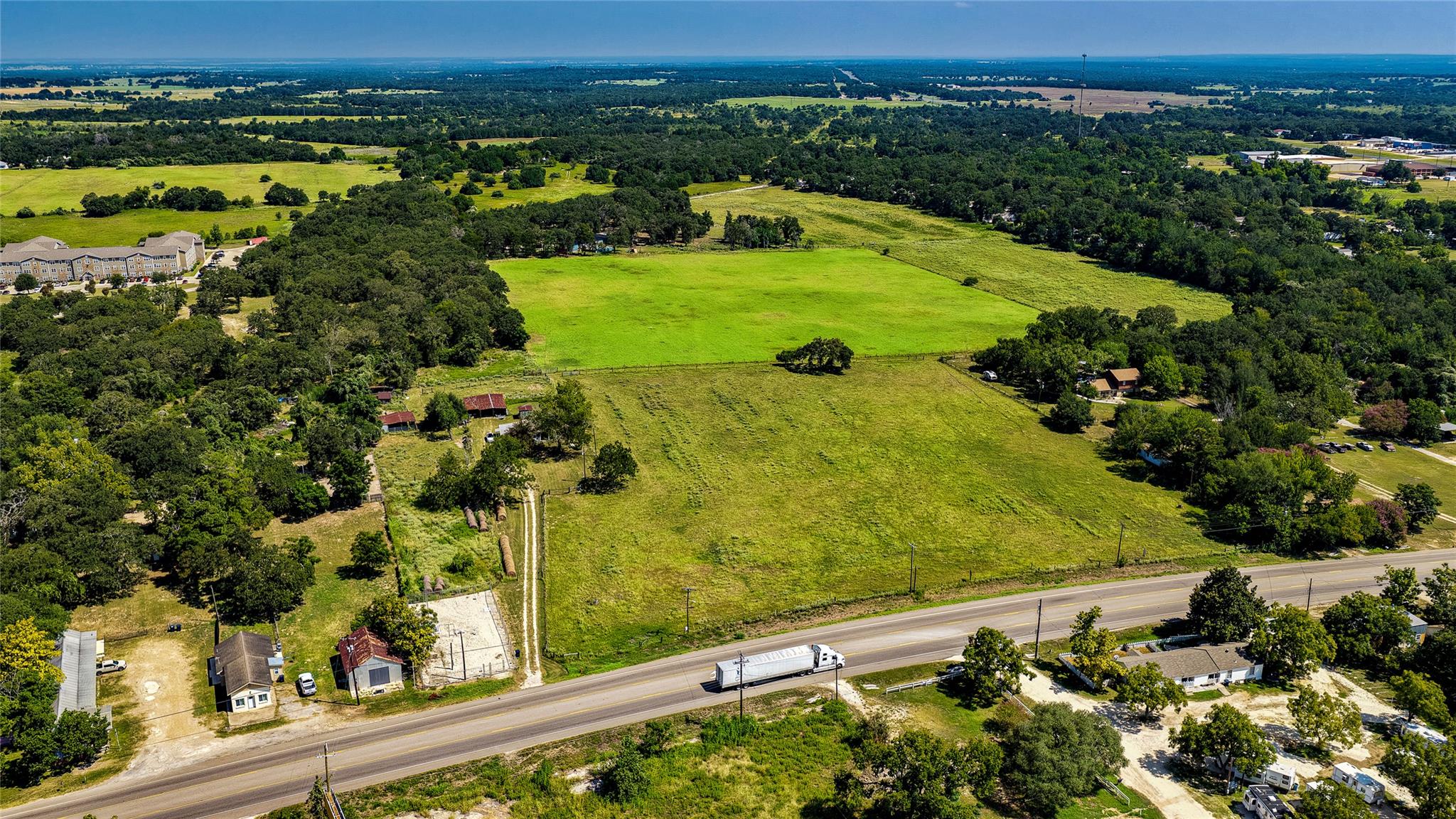 Vast green acreage unfolds, offering a panoramic 