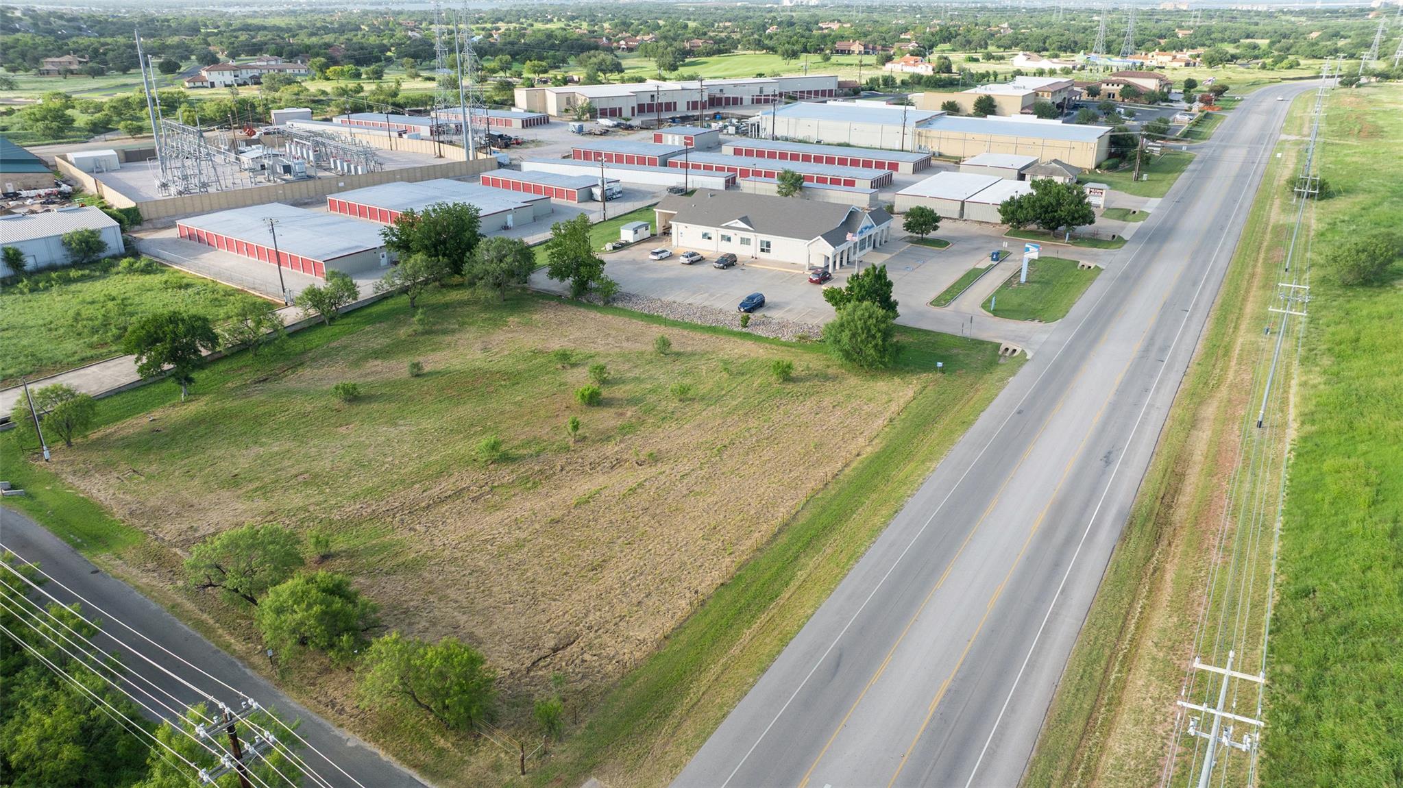 A spacious, cleared lot offers prime commercial d
