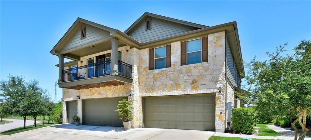 A striking stone and siding facade defines this t