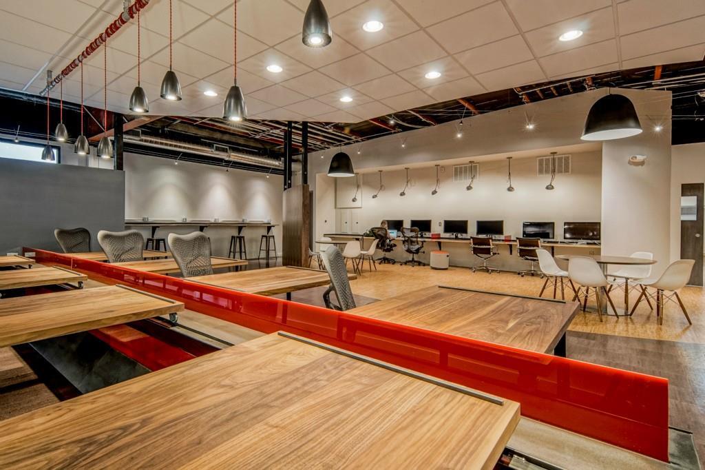 An open-concept workspace features industrial-chi
