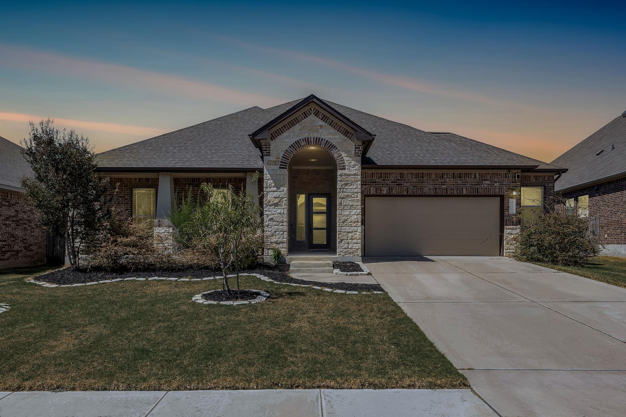 An arched stone entryway highlights the classic b