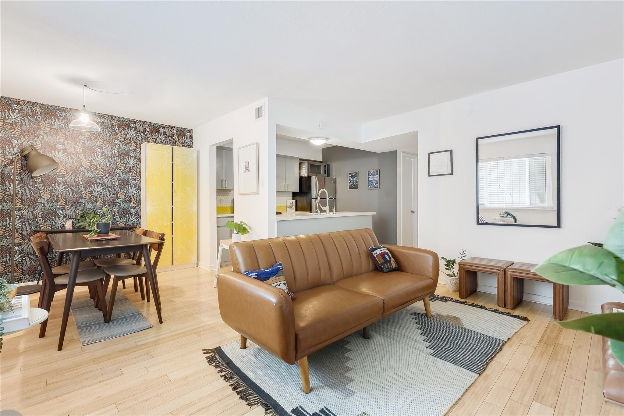Smooth wood floors flow seamlessly through this o