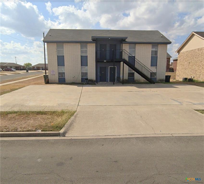 Two-story apartment building with exterior stairc