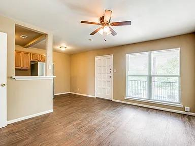 Hardwood-style flooring extends through this airy