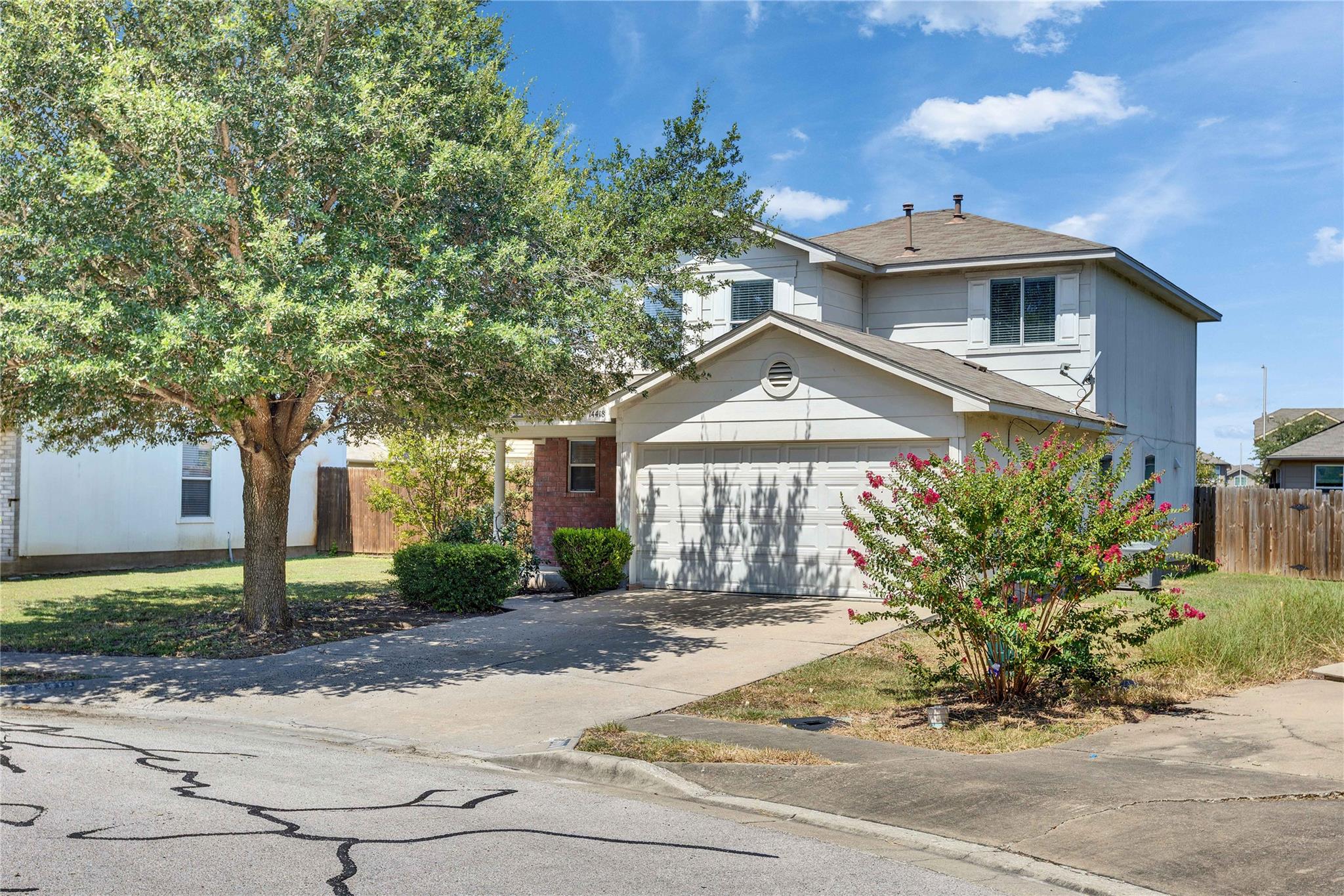 A classic facade with a welcoming front yard, a d