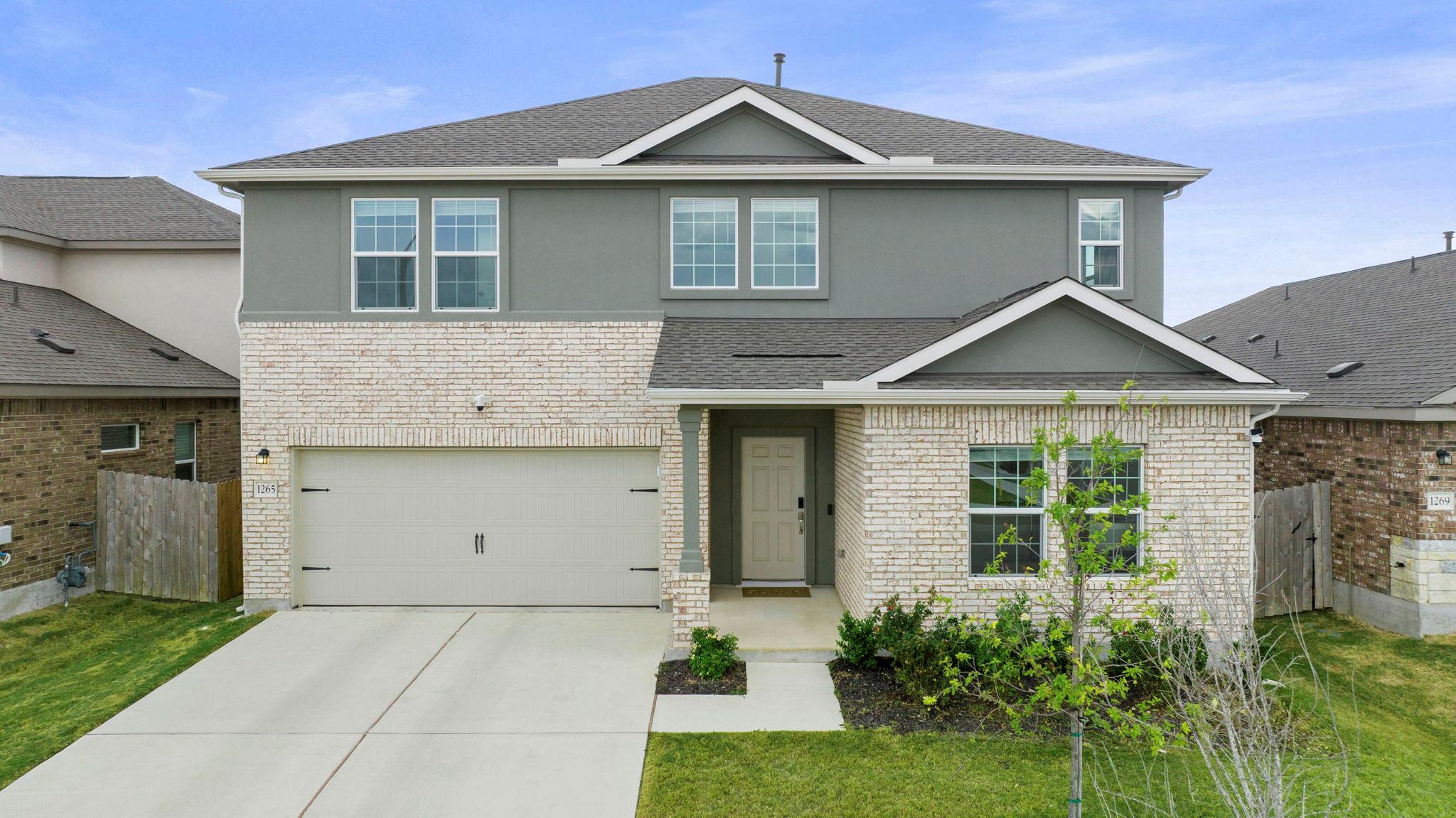 A welcoming facade features a combination of bric