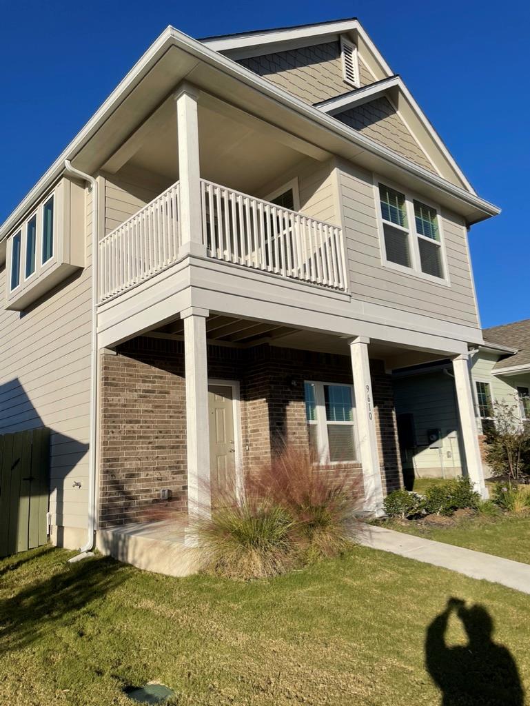 A charming facade features a covered front porch 