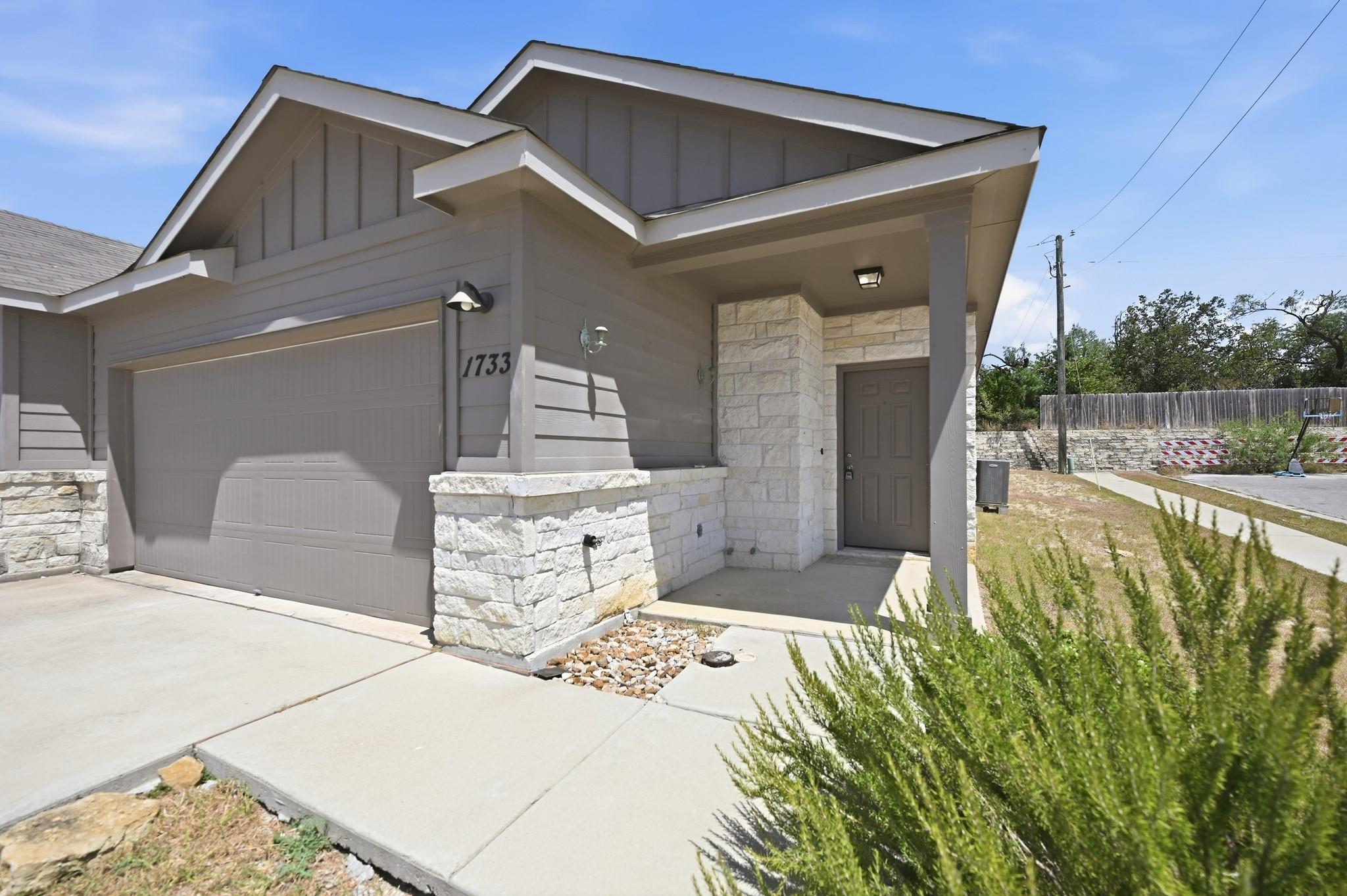 Clean architectural lines and stone accents defin