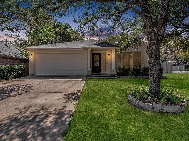 A classic facade with a well-maintained lawn and 