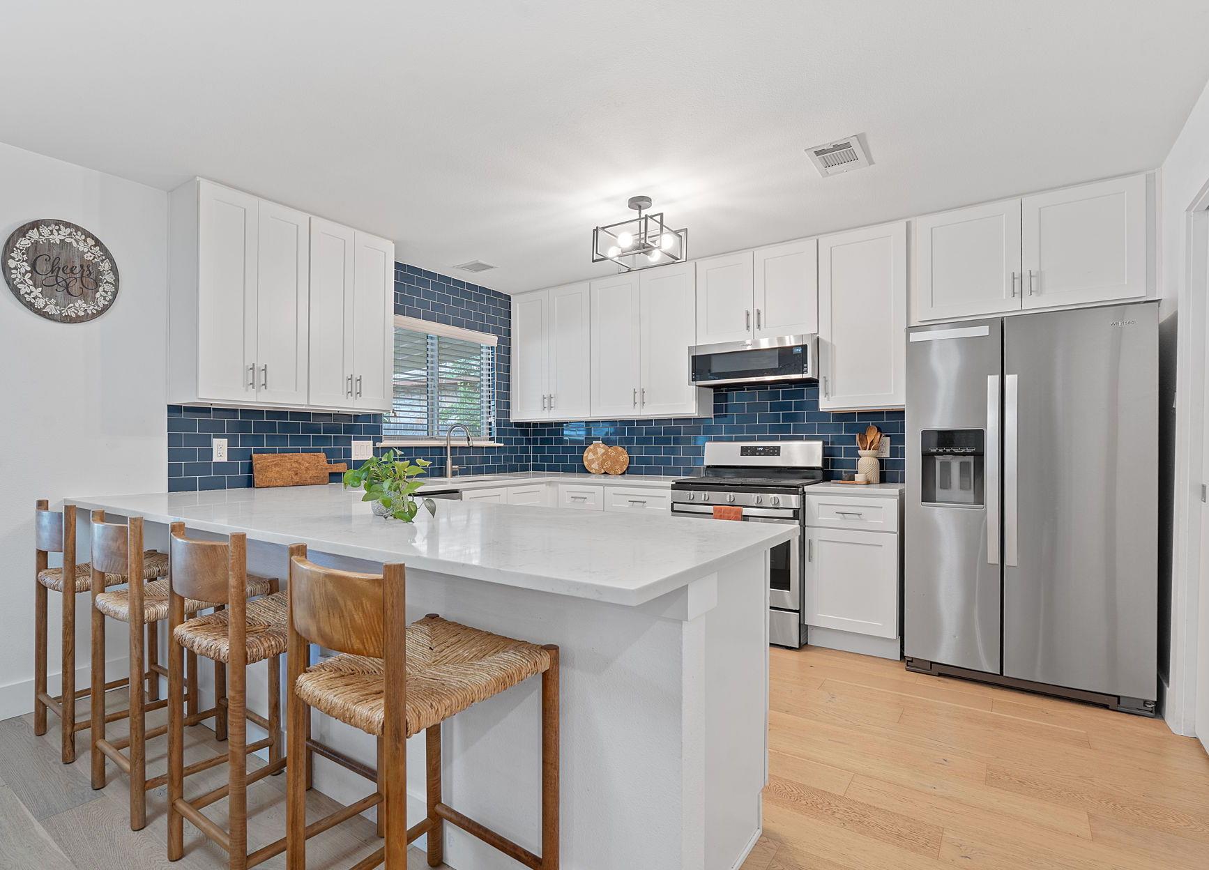 Kitchen featuring stainless steel appliances, a p