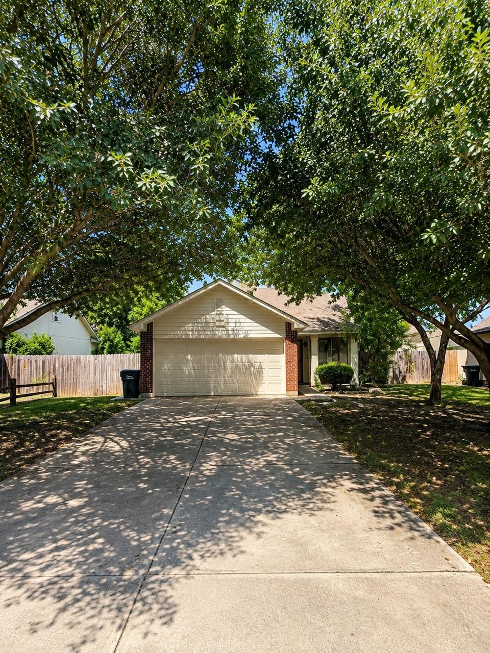 Mature trees shade this charming residence with a