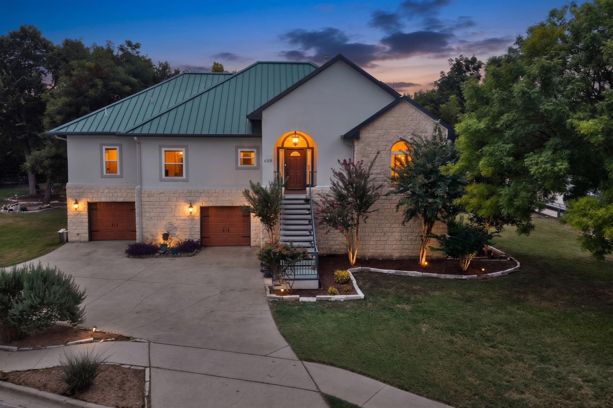 A striking exterior featuring stone and stucco ac