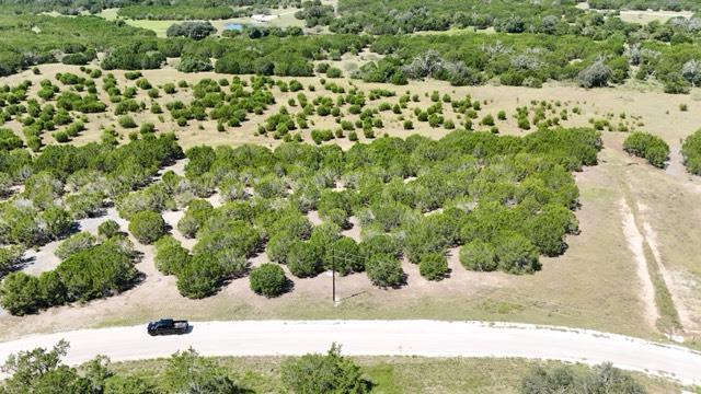 An aerial perspective reveals a winding paved roa