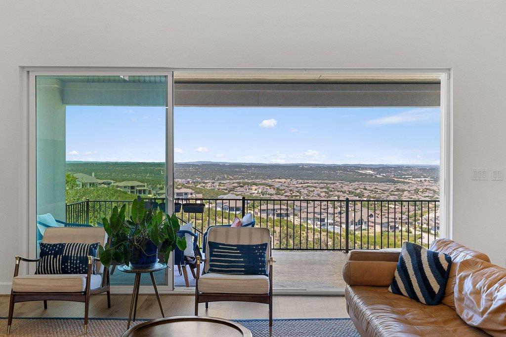 Massive sliding glass doors reveal panoramic vall