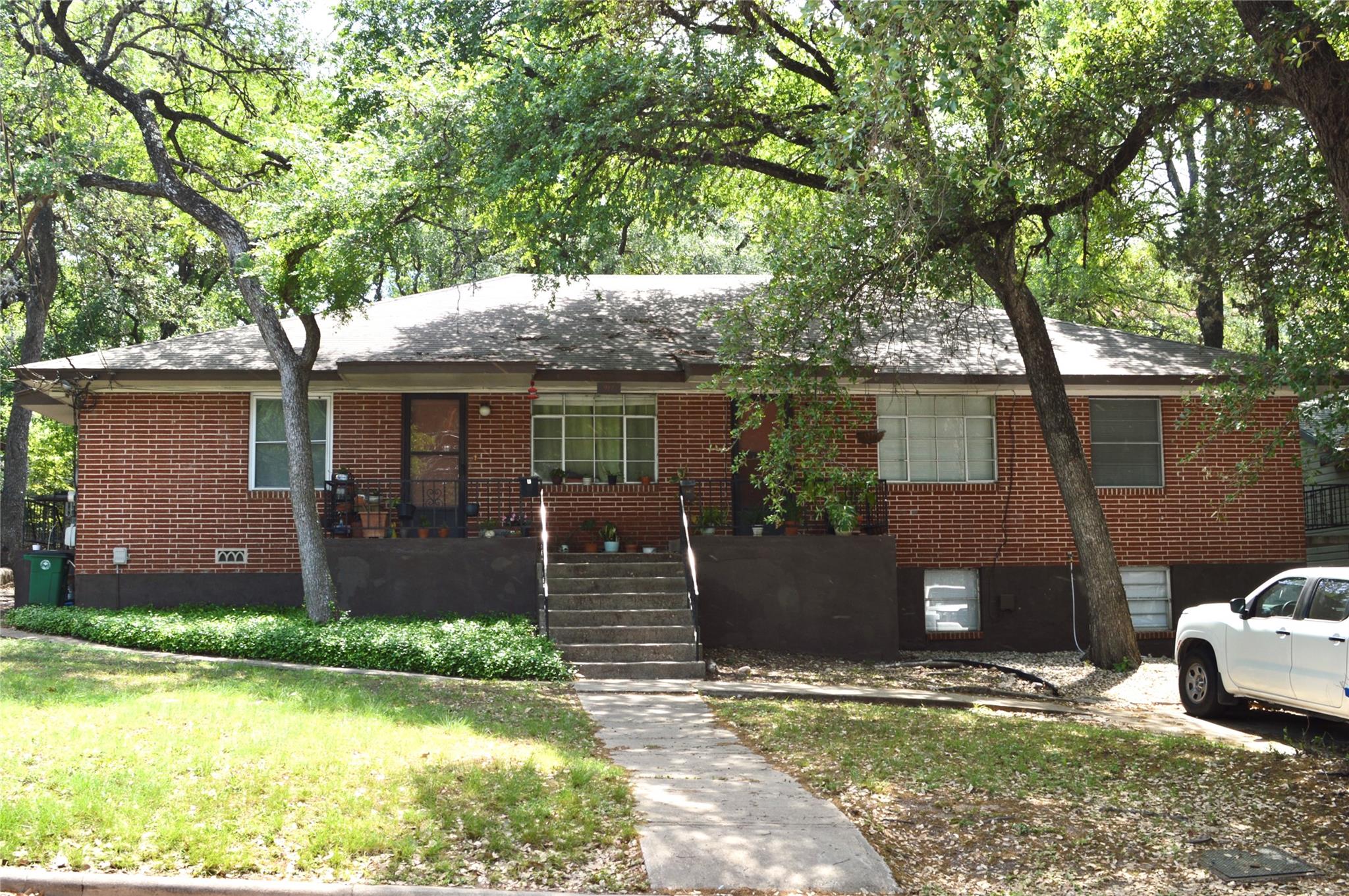 Ranch-style home featuring brick siding and a fro
