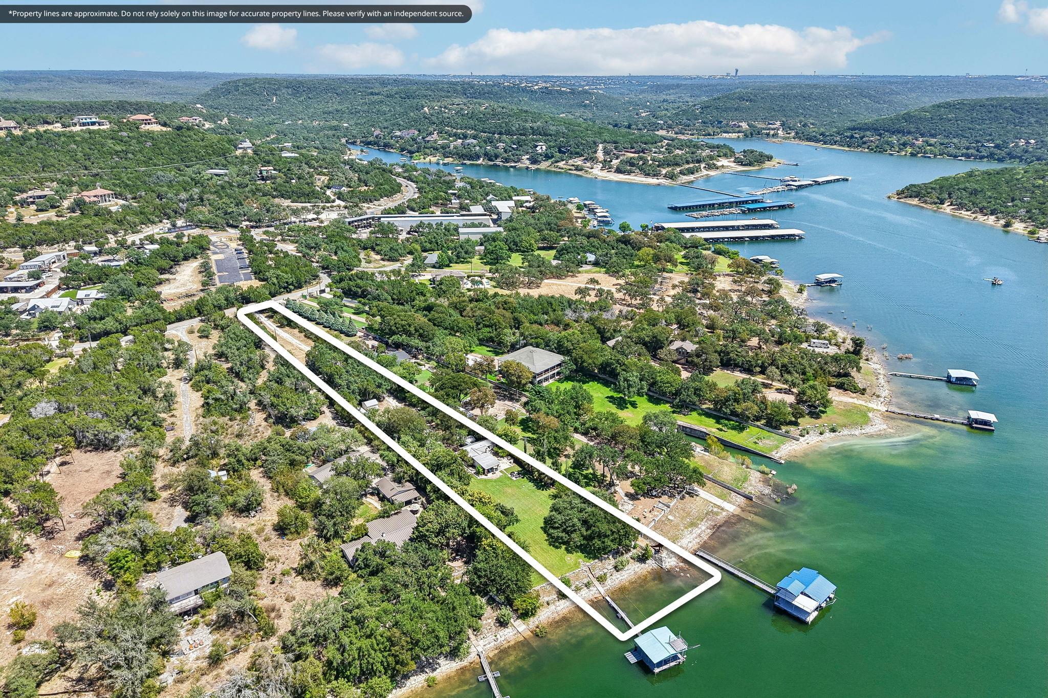 A long grassy lot slopes gently down to the water