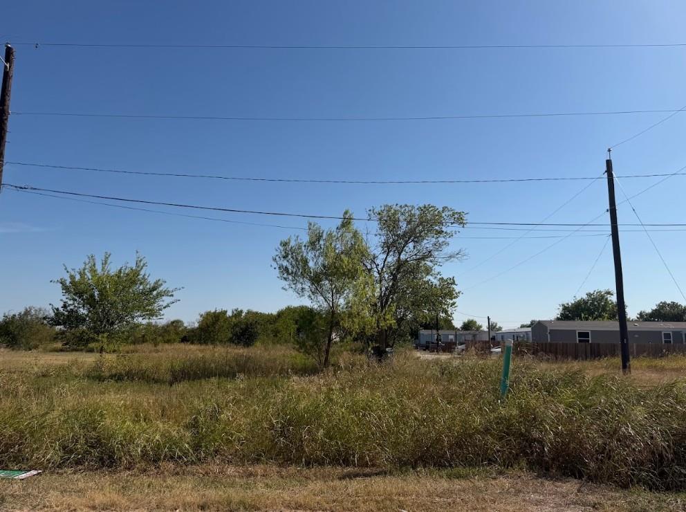 Mature trees and open grassy areas define this ex