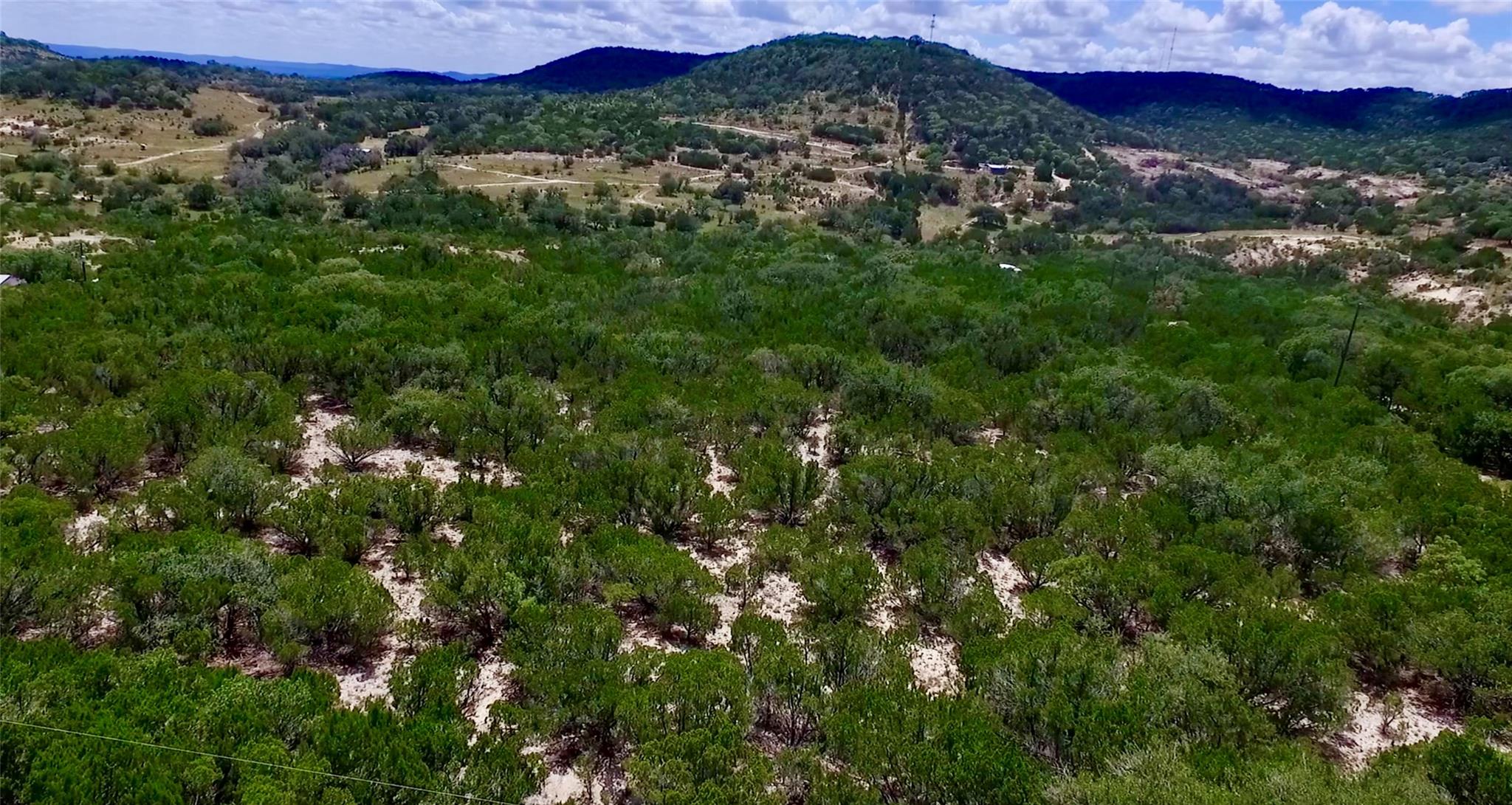 Rolling green hills stretch across the horizon un