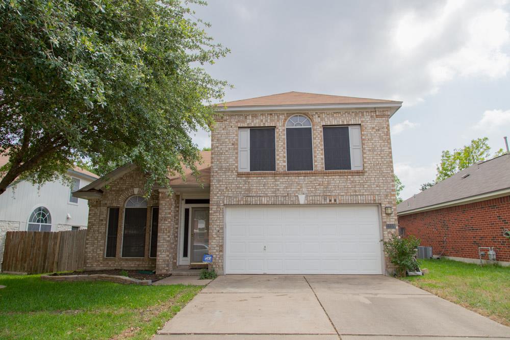 Classic brick exterior showcases arched windows a