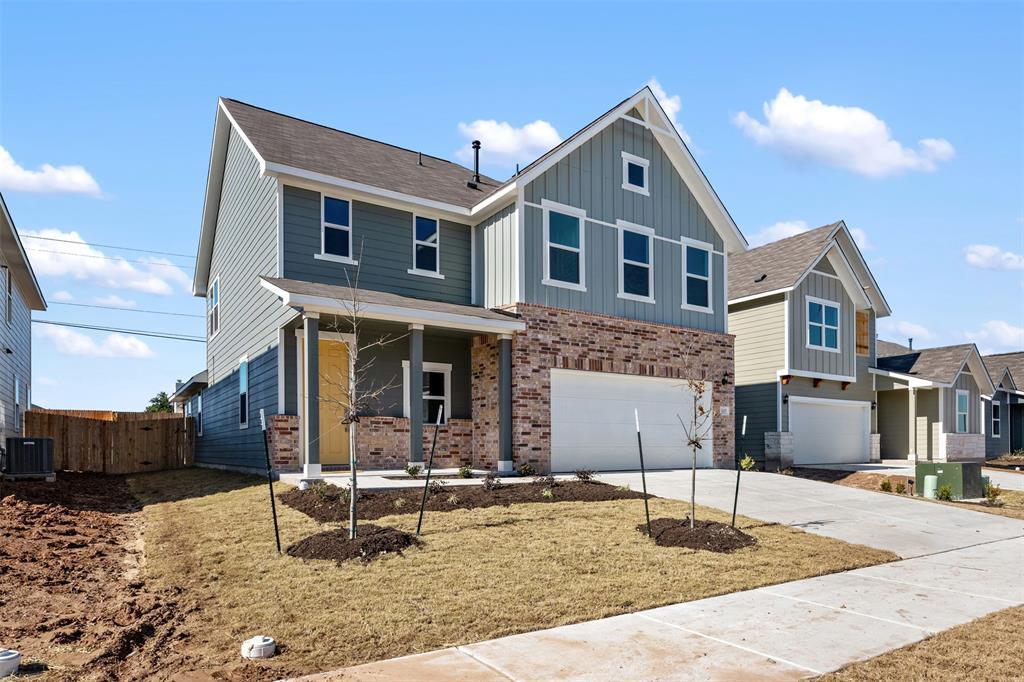 Board and batten siding pairs with brick accents 