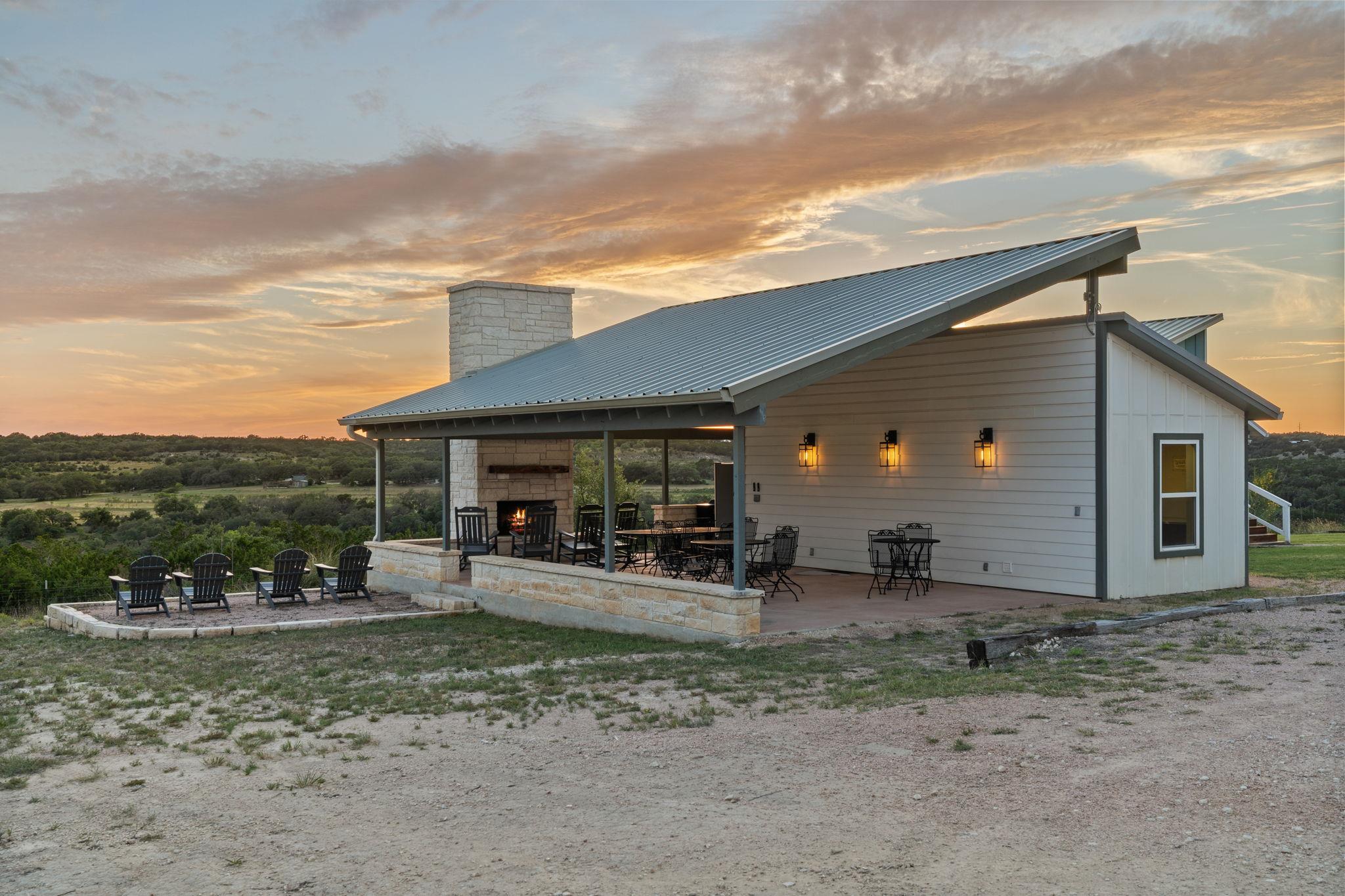 A spacious covered patio anchors this outdoor liv