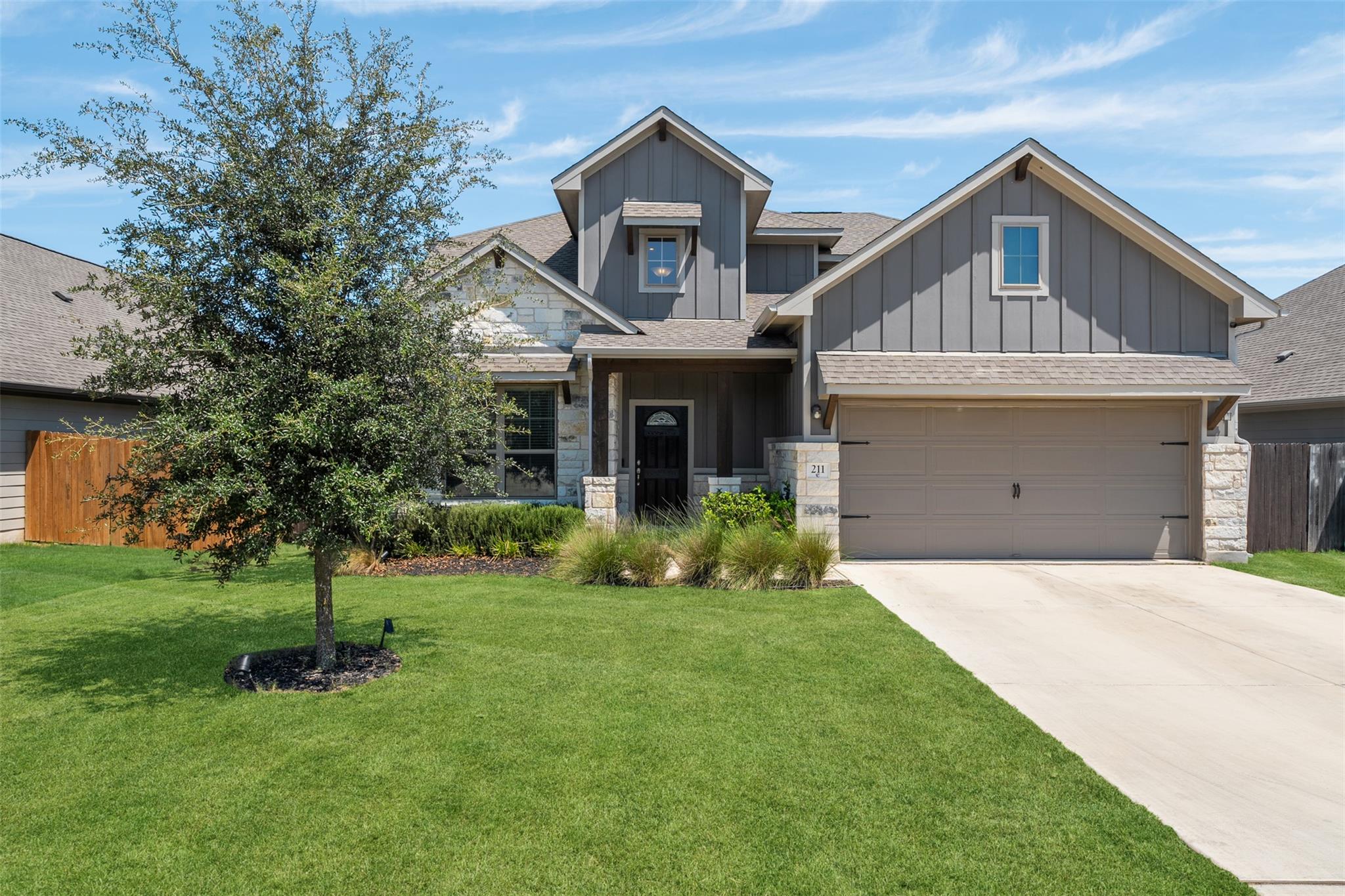 Craftsman architectural elements and stone accent
