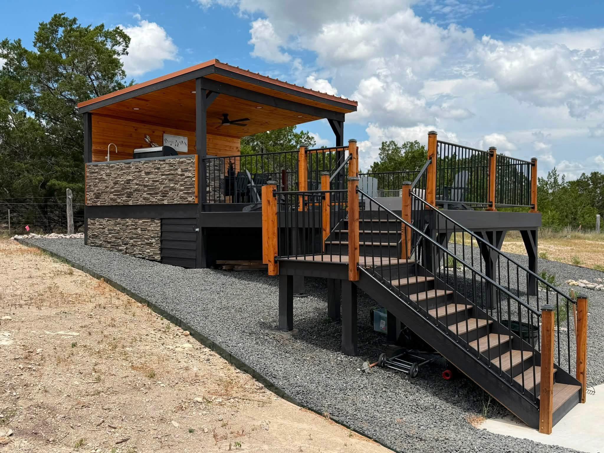 Multi-level wooden deck features a covered outdoo